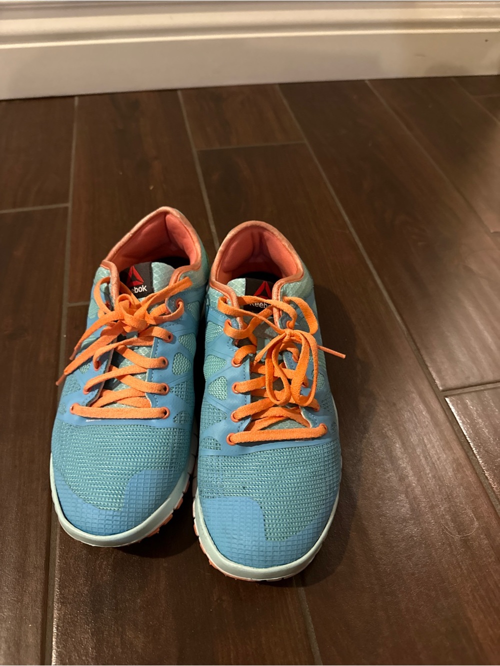 Reebok Light Blue Sneakers with Orange Accents